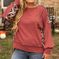 Casual plus-size geometric print sweatshirt styled for fall.
