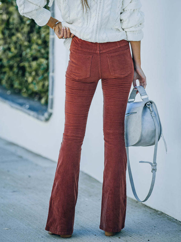 Casual reddish-brown flared corduroy pants styled for fall and winter.
