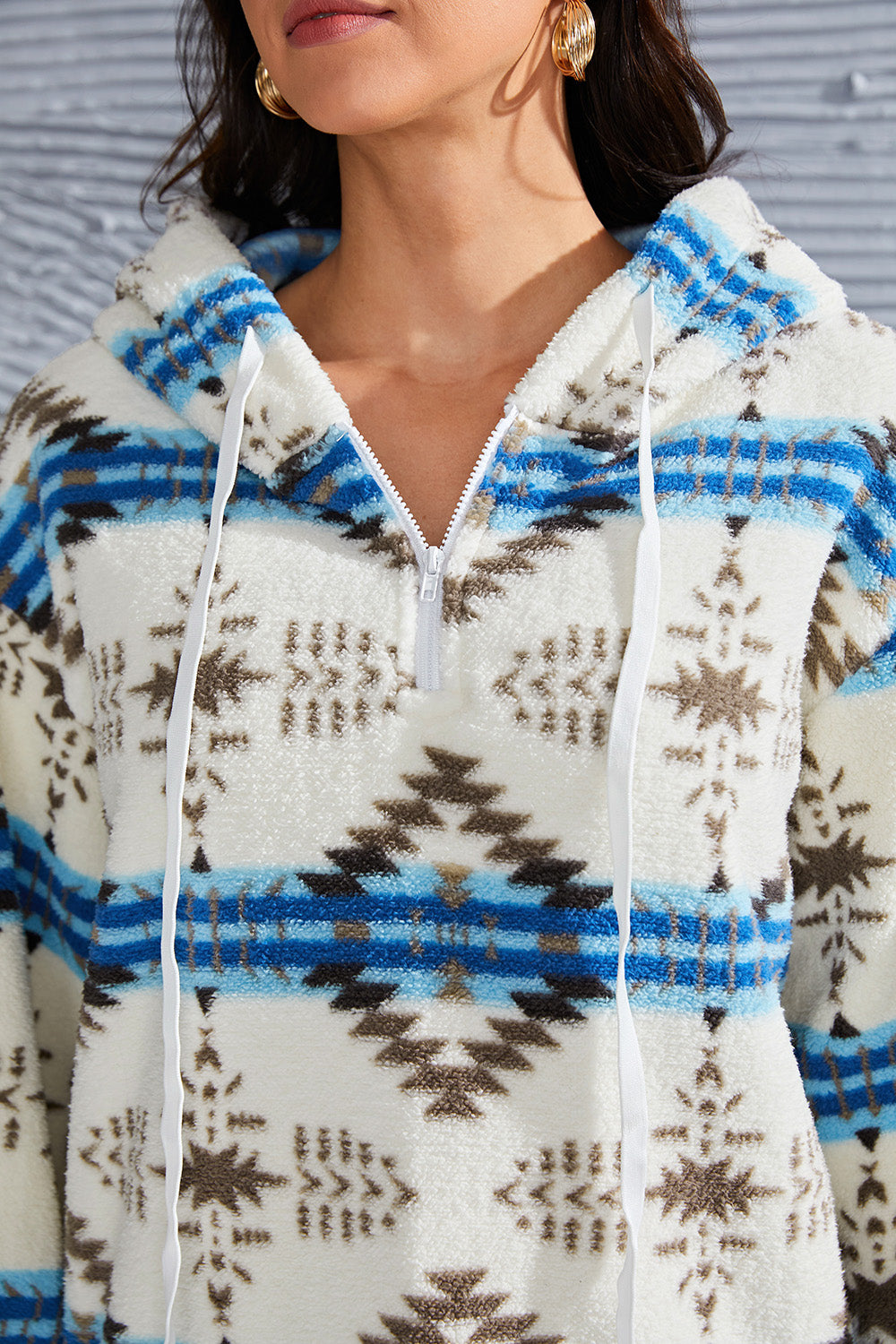 Southwestern-patterned fleece hoodie with ribbed cuffs and hem for a comfy fit.