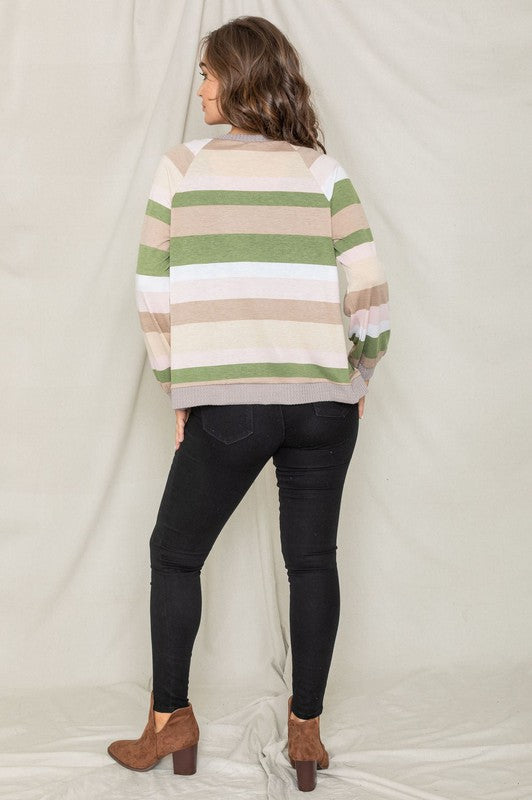 Olive cardigan featuring a tie-front design and colorful striped pattern.