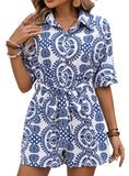 Blue and white boho print romper with button-down front.