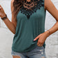 Stylish sage green sleeveless top with delicate black lace neckline, paired with distressed denim shorts for a chic summer look