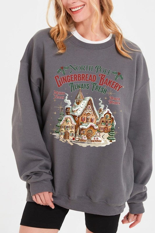 Warm charcoal gray sweatshirt featuring North Pole Gingerbread Bakery holiday design.