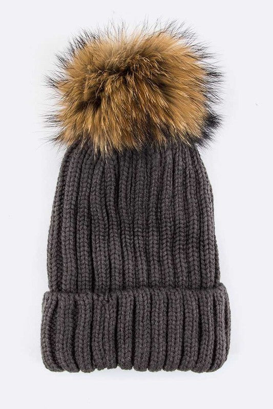 Charcoal ribbed knit winter hat with a cozy faux fur pom for added warmth.