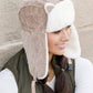 Playful kitten ear hat with cozy lining
