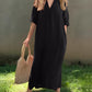 Chic black midi dress with practical side pockets
