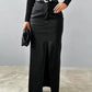 Fashionable black high-waisted leather skirt for women with a front slit.
