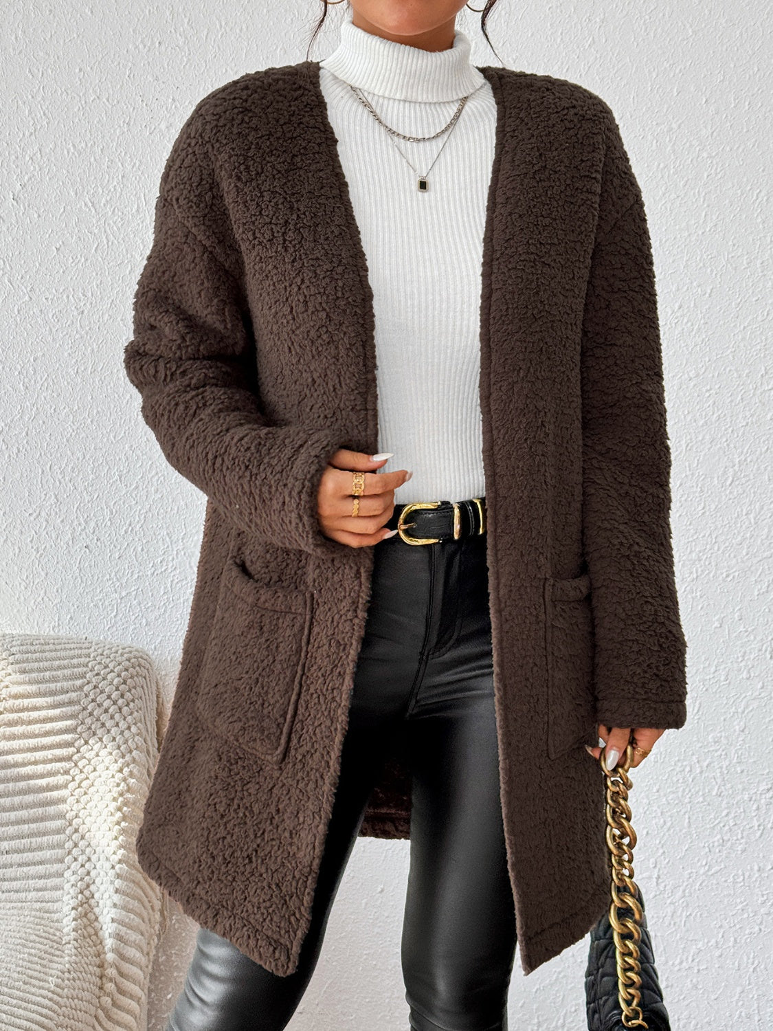 Chic brown coat for women, perfect for fall and winter layering.
