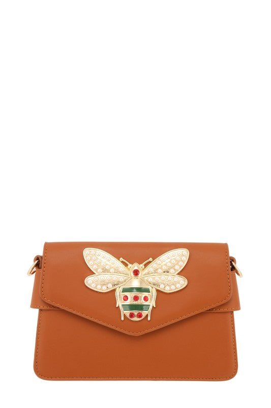 Stylish camel bag with bee embellishment and compact, functional design.
