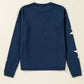 Chic navy sweater with a bold star pattern, perfect for casual, everyday wear.