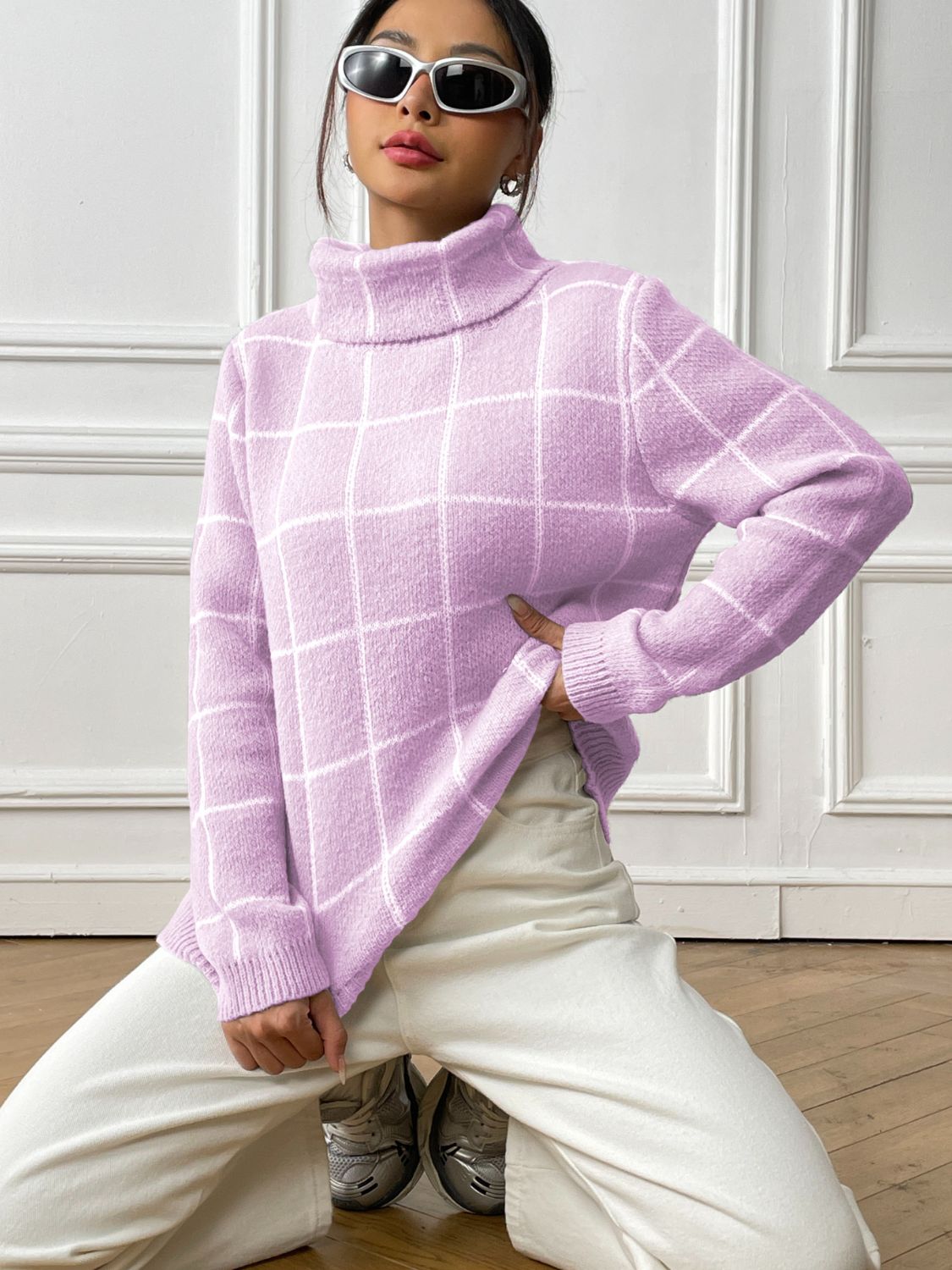 Soft pink knit turtleneck sweater with chic plaid design