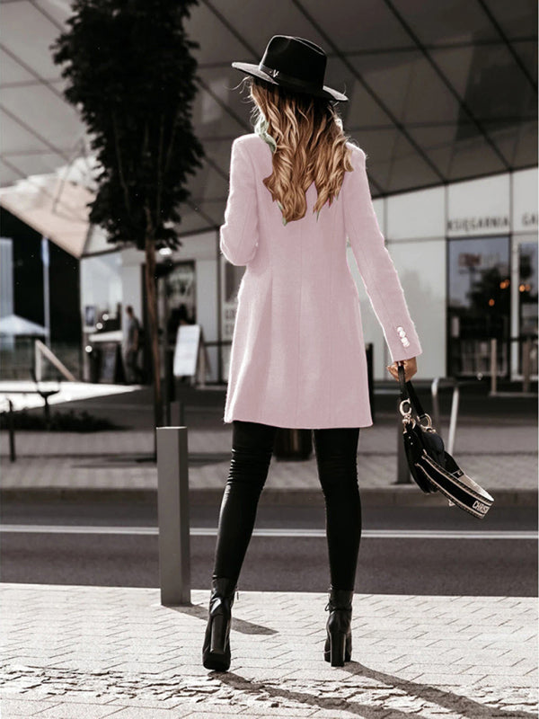 Stylish pink double-breasted coat ideal for casual layering.
