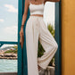 Women's flowy wide-leg pants in white with a comfortable drawstring waist.