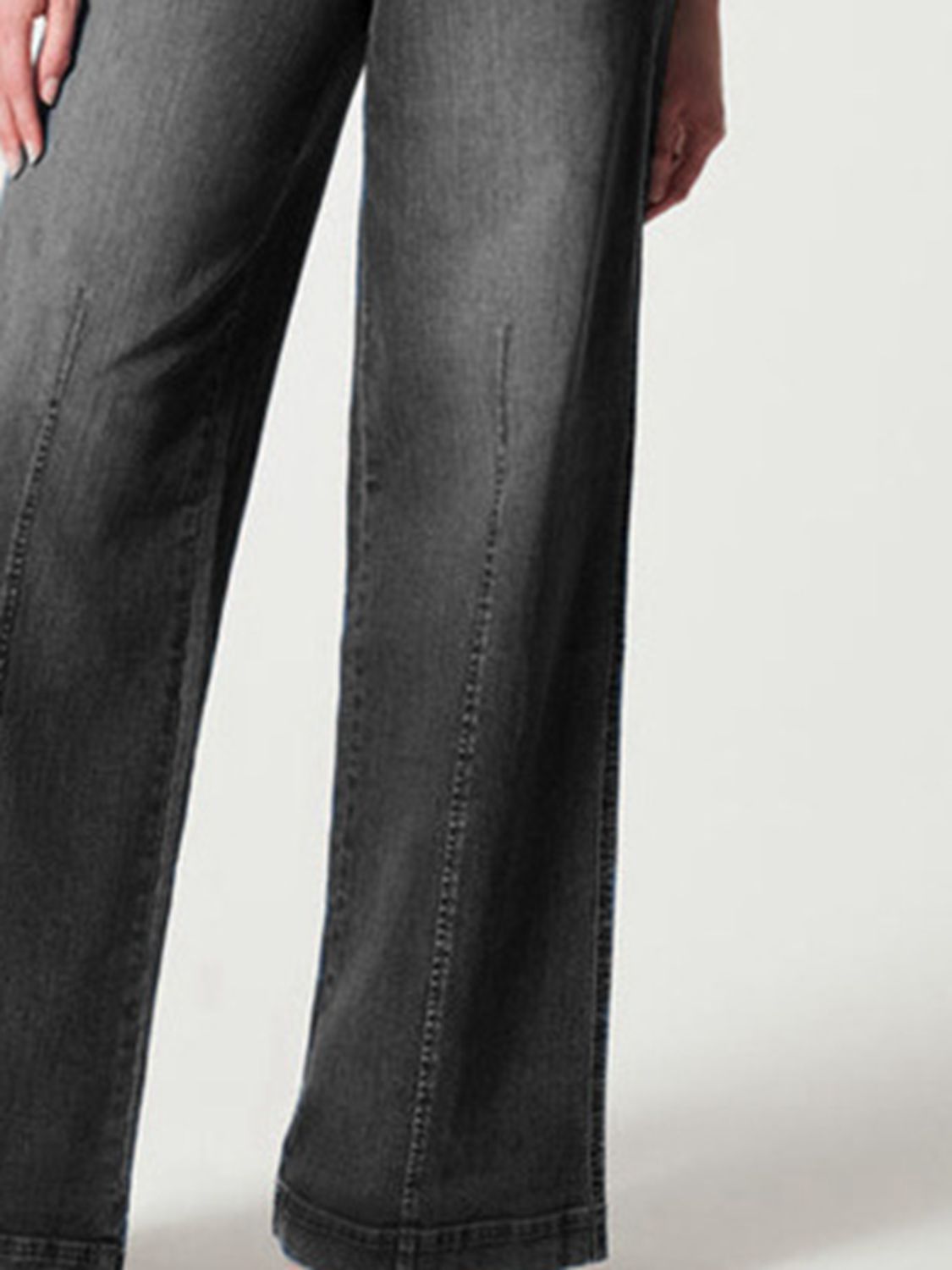 Women's black high-rise wide-leg jeans with a chic, modern look.
