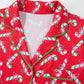 Detailed view of the Christmas pajama set, highlighting the candy cane print and knotted bow on the shorts.