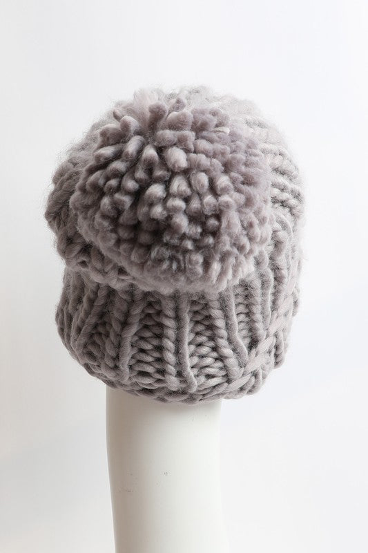 Stylish gray knit hat with a chunky cable pattern, made from durable acrylic