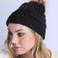 Comfortable black beanie featuring intricate braided design

