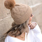 Camel chunky knit fur pom beanie with soft stretch and cozy fit
