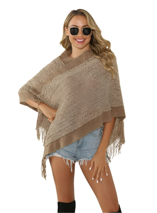 Chunky knit khaki poncho with fringe for cozy layering
