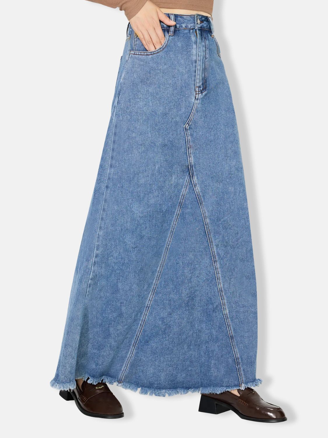 Classic A-line denim skirt with raw hem for an edgy look.
