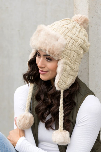 Classic cable weave trapper hat with braided accents
