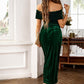 Green off-shoulder midi dress with ruched detail and draped silhouette.
