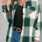 Green plaid shirt layered over a basic top and styled with casual jeans.
