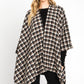 Black plaid wrap shawl adding warmth and style for cold days.
