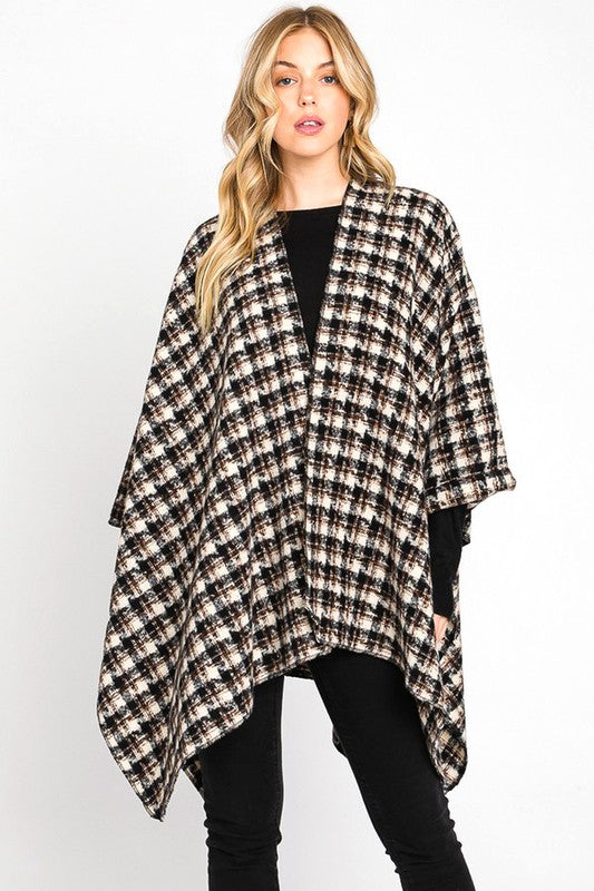 Black plaid wrap shawl adding warmth and style for cold days.
