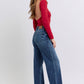 Flattering raw hem jeans in a medium wash for versatile styling
