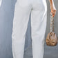 Classic white tapered jeans made from a cotton blend with no stretch.
