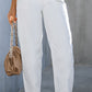 Chic white tapered jeans perfect for business casual outfits.
