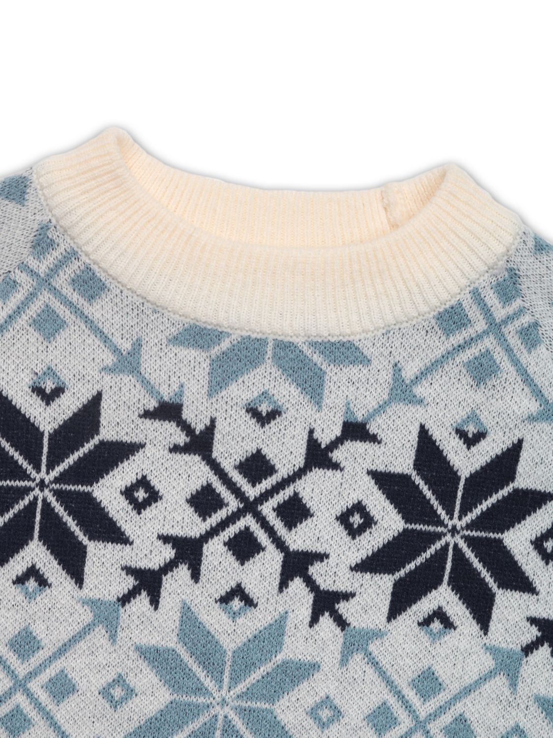 Close-up of the blue and white snowflake pattern, showcasing the intricate winter design.

