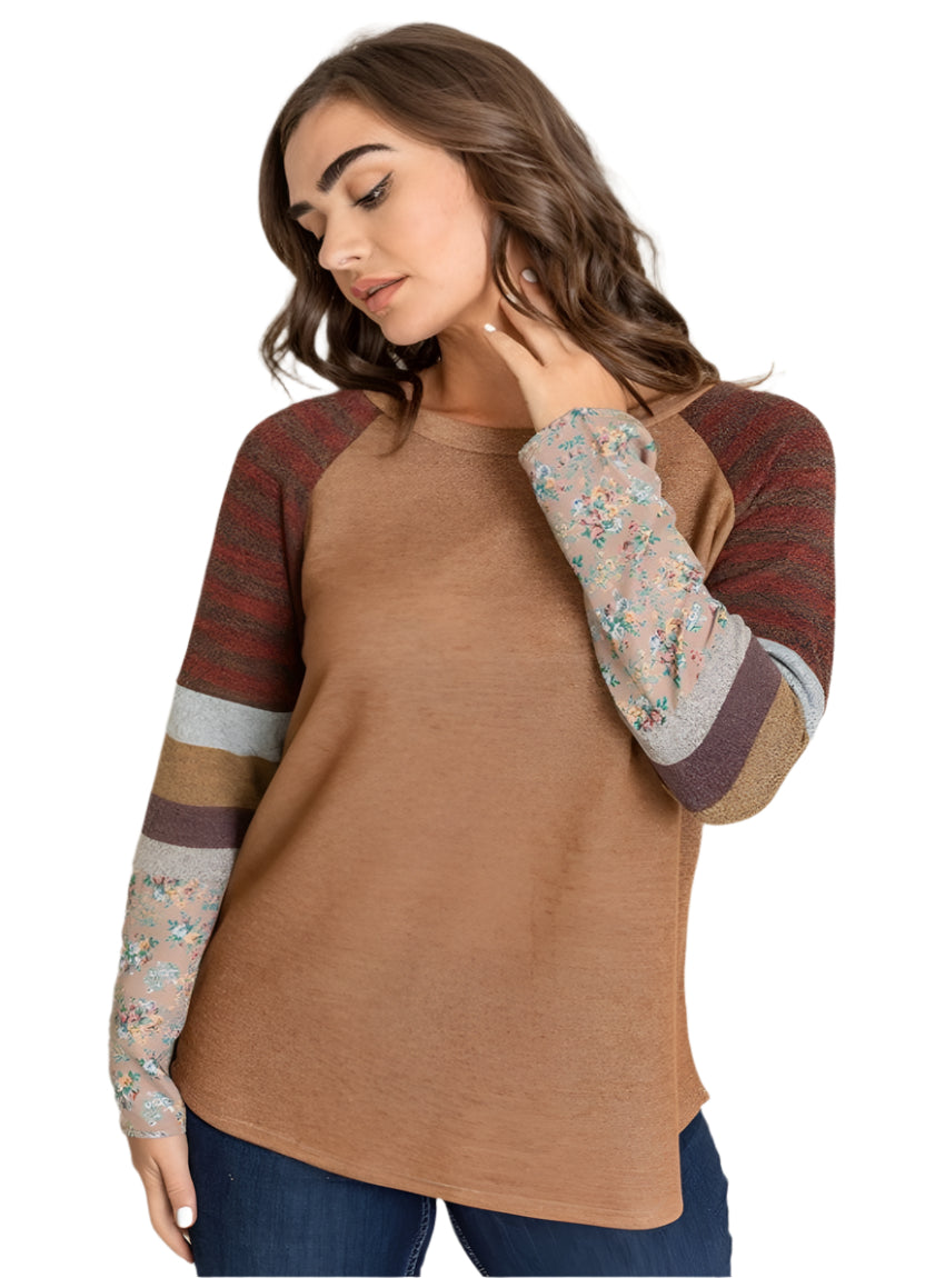 Front view of a color block sleeve tunic in camel with floral and stripe accents.
