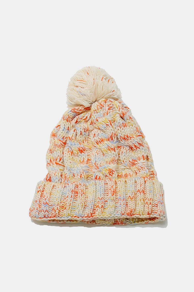 Cream multicolor knit pom-pom beanie featuring vibrant thread details and chunky knit texture
