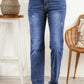 Stylish high waist straight-leg jeans with raw hem and distressing.
