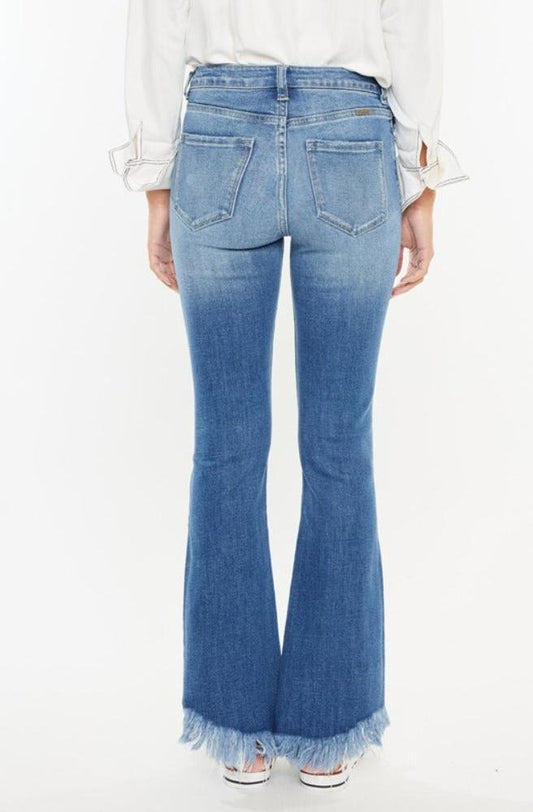 Trendy high-rise jeans with a raw hem by Kancan for a chic look.
