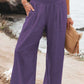 Relaxed fit purple wide leg pants with smocked waistband
