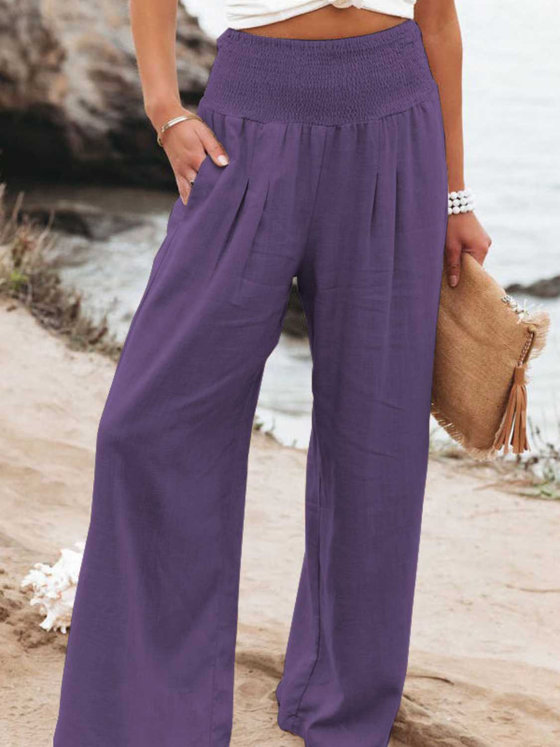 Relaxed fit purple wide leg pants with smocked waistband
