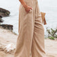 Relaxed fit tan wide leg pants with smocked waistband
