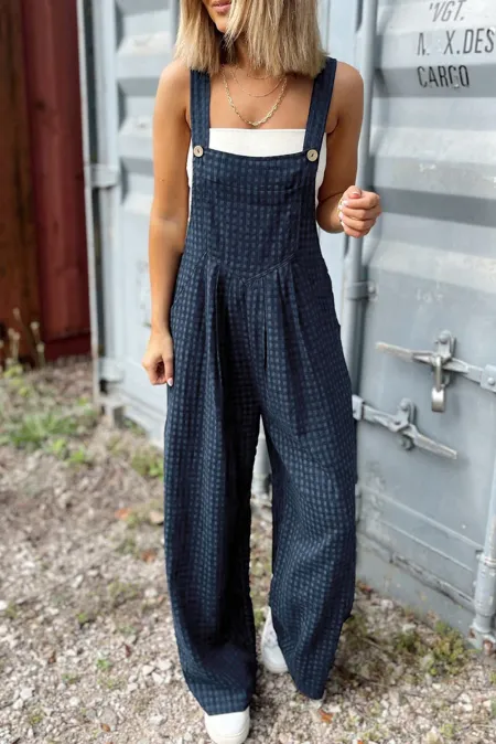 Relaxed-fit plaid overalls designed for casual, comfortable outfits.
