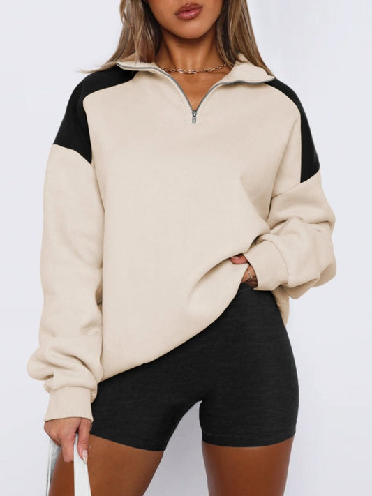 Tan color block half-zip sweatshirt, a cozy and trendy option.
