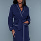 Full-length view of a navy waffle robe with a belted waist and patch pockets, perfect for lounging.
