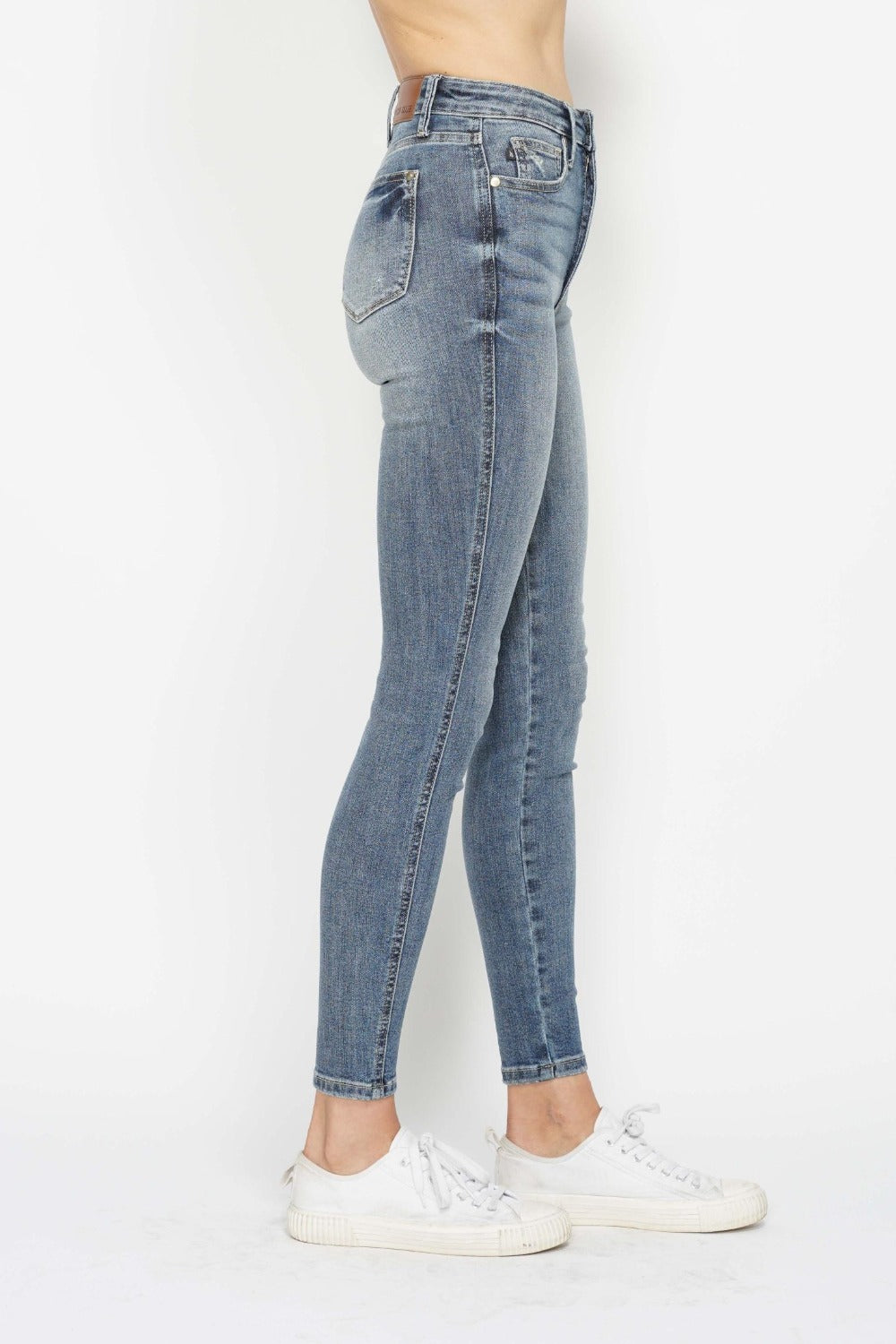 Side view of women’s skinny jeans with a sleek, streamlined fit.
