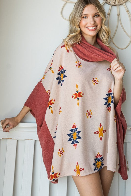 Beige cowl neck poncho with colorful Aztec print, ideal for fall layering.