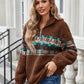 Cozy brown half-zip sweatshirt with colorful Aztec print, perfect for winter warmth.
