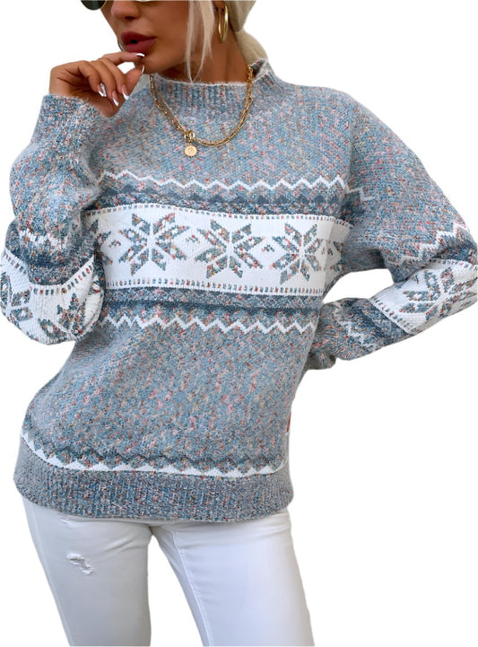 Cozy cloudy blue snowflake knit sweater with ribbed cuffs and hem for a warm, stylish look.

