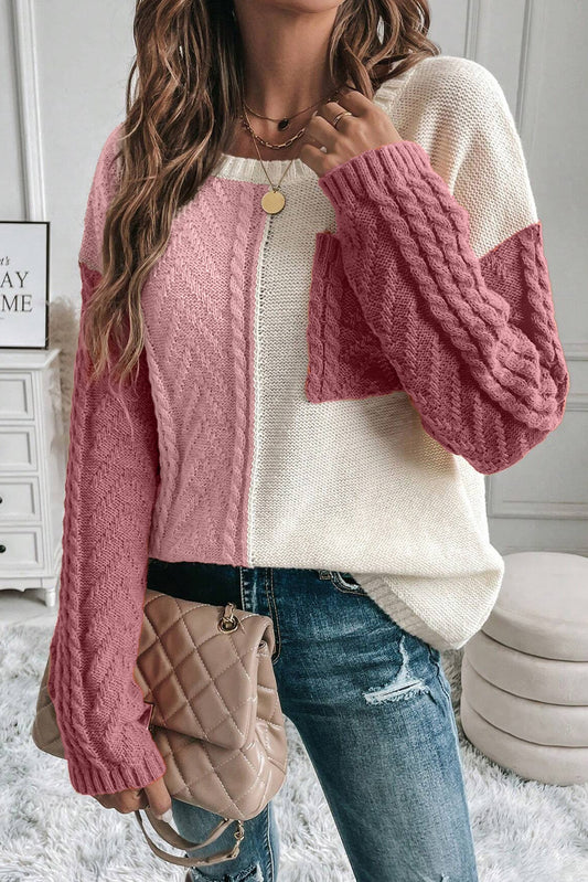 Pink color block cable knit sweater paired with casual outfit.
