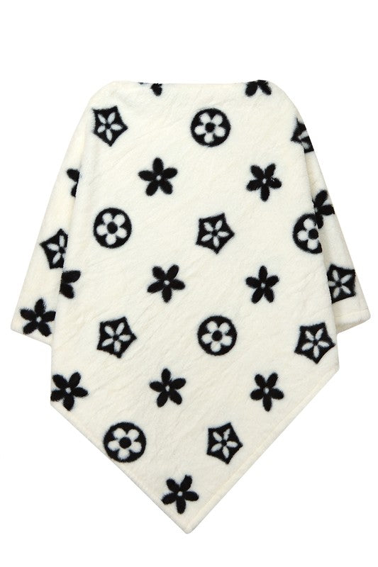 White floral patterned poncho with soft material
