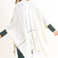 Ivory knit shawl with fringe hem adding cozy style to any look.
